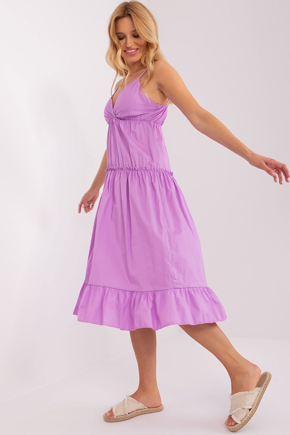 Woman wearing a purple dress on a white background