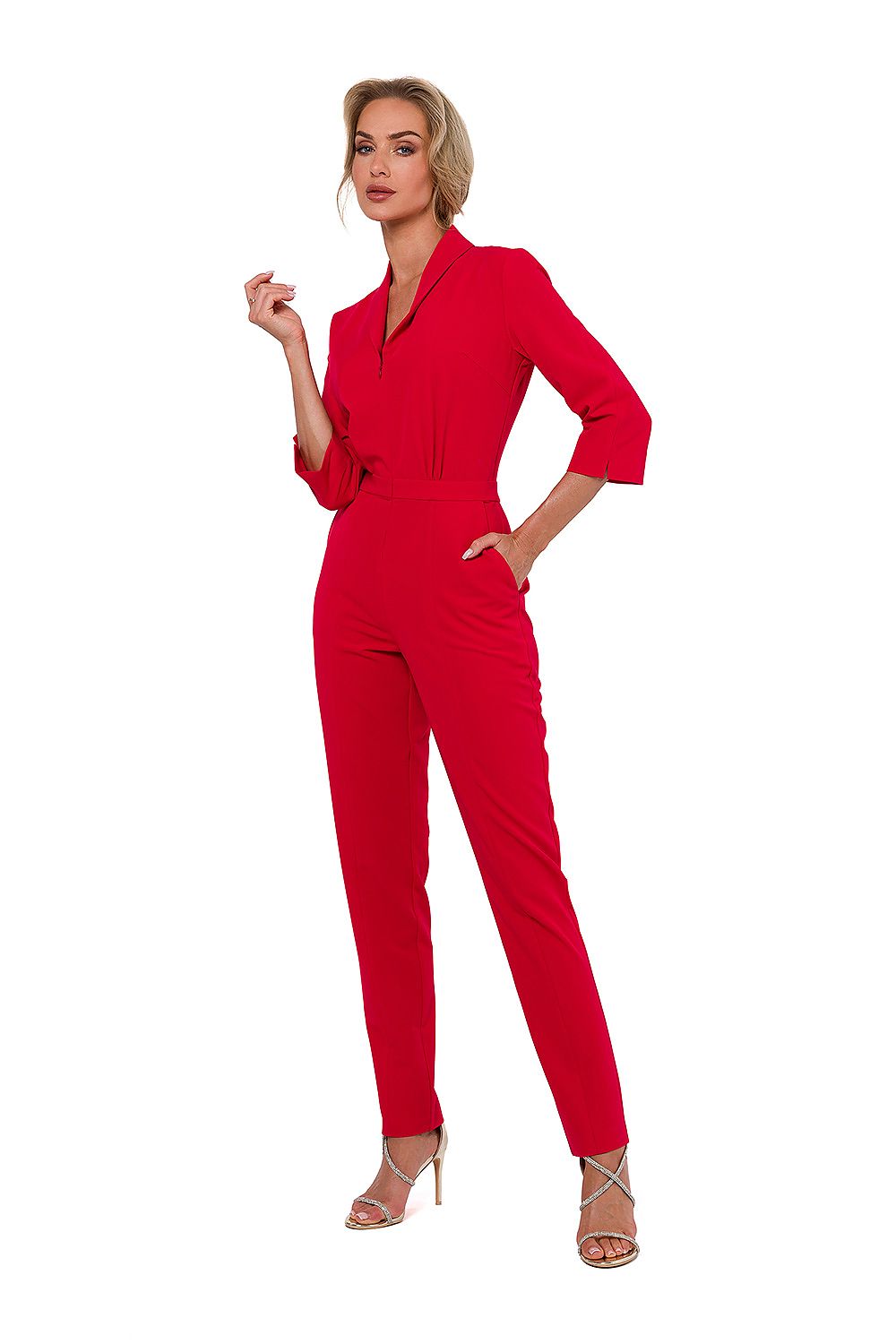 Woman wearing a red jumpsuit on a white background