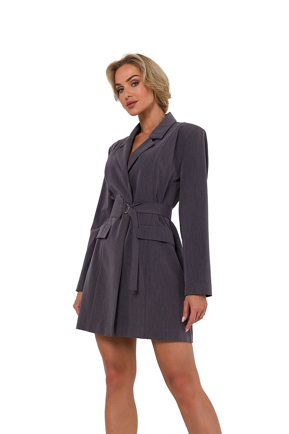 Woman wearing a gray blazer dress on a white background