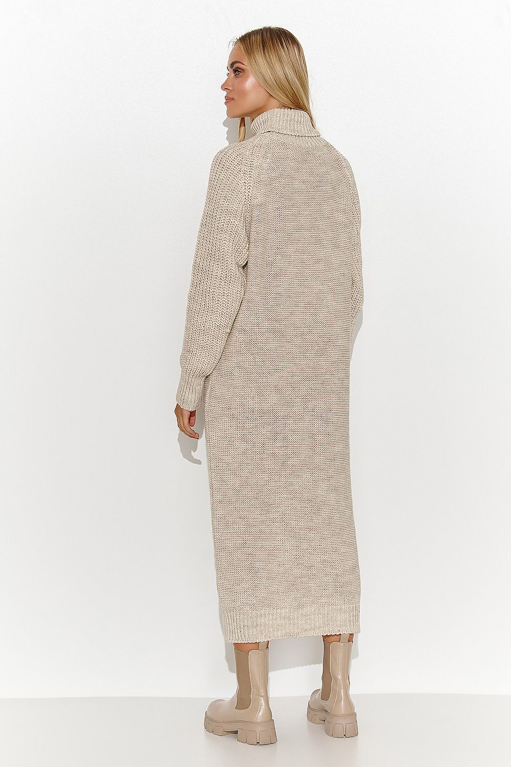 The Solvéra Beige Turtleneck Check-Panel Knit Dress featuring long relaxed sleeves and a distinctive checked front panel. rear view