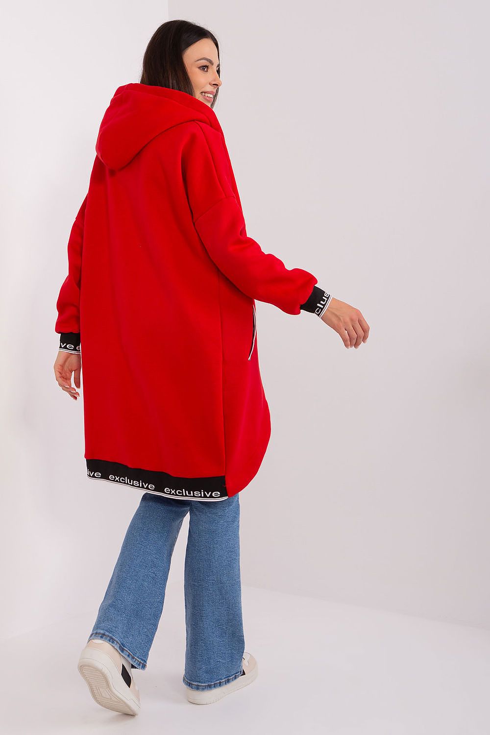 Person wearing a red hoodie and blue jeans on a white background