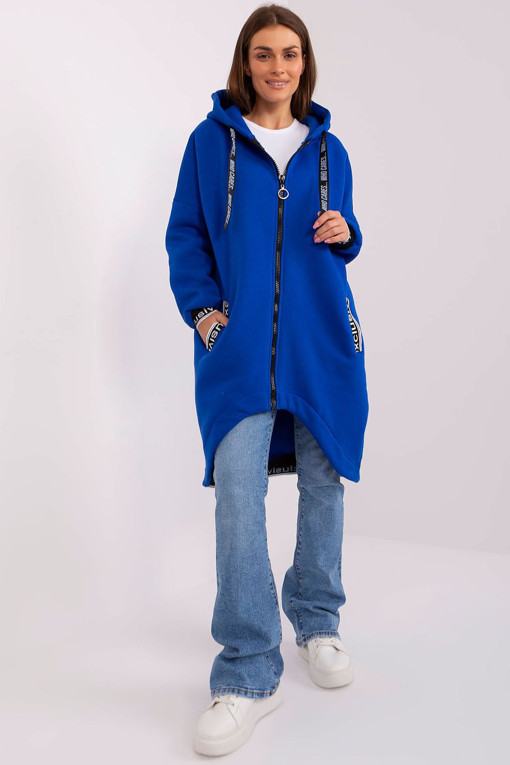 Person wearing a blue hooded coat on a white background