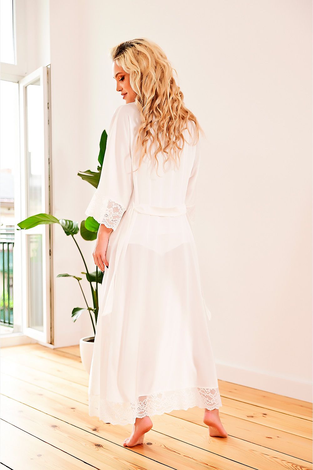  Close-up of beige Sumatra gown showing lace texture and satin sheen