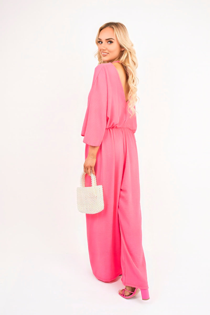 Fuchsia: “Wide leg V-neck jumpsuit in fuchsia with back tie detail, side view”
