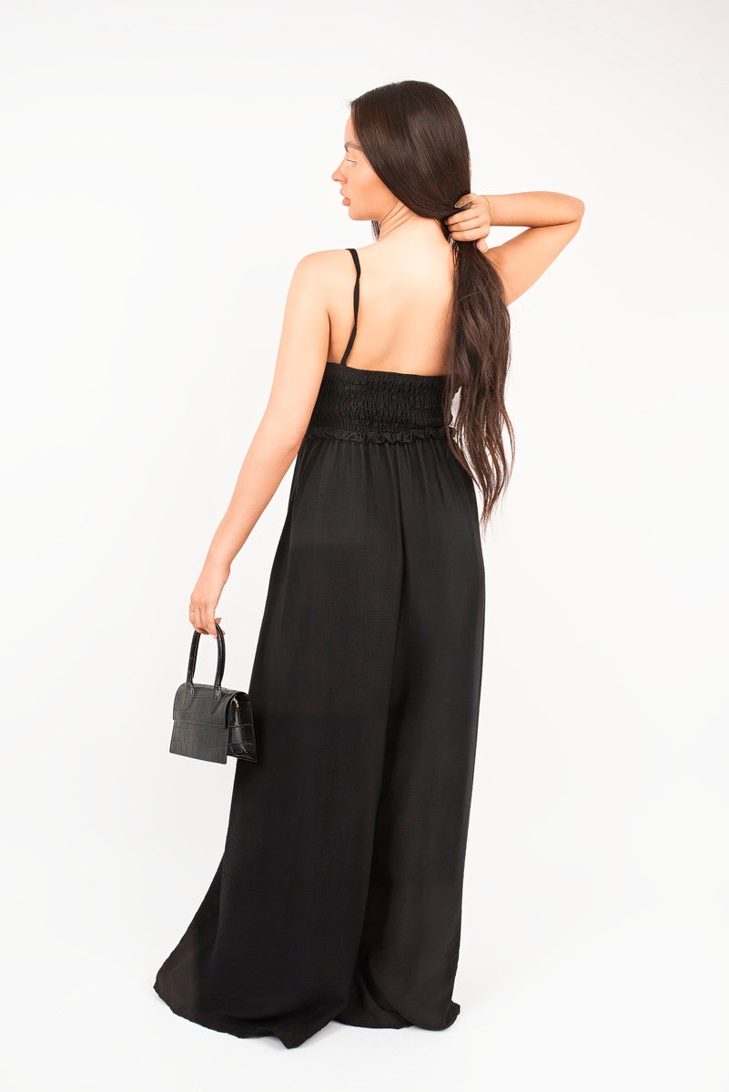 “Black shirred bandeau wide leg jumpsuit, back view”